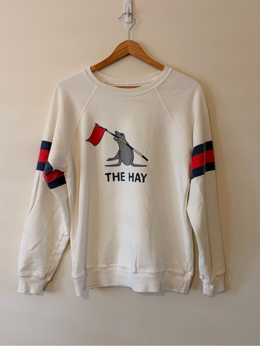 The Hay Seal Graphic Crewneck Sweater in White with Red & Navy Stripes